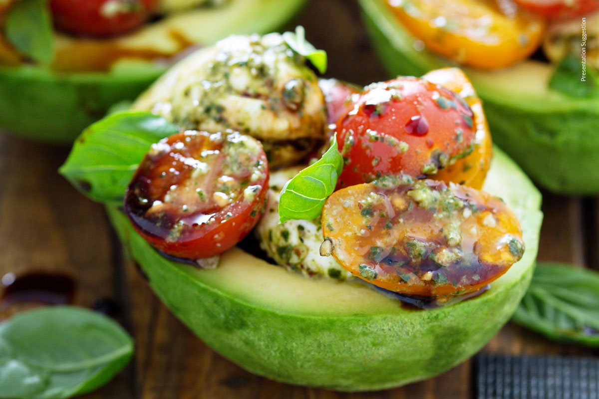 Avocado stuffed with tomato mozzarella salad